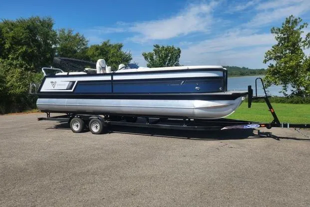 The Image of 2023 Viaggio Diamante U pontoon boat on trailer, parked near a lake. - 0