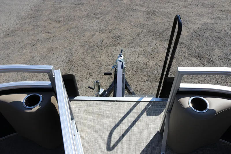 Slide: The Image of 2025 Sun Chaser Vista Fish 18 pontoon boat with trailer hitch and cup holders. - 15