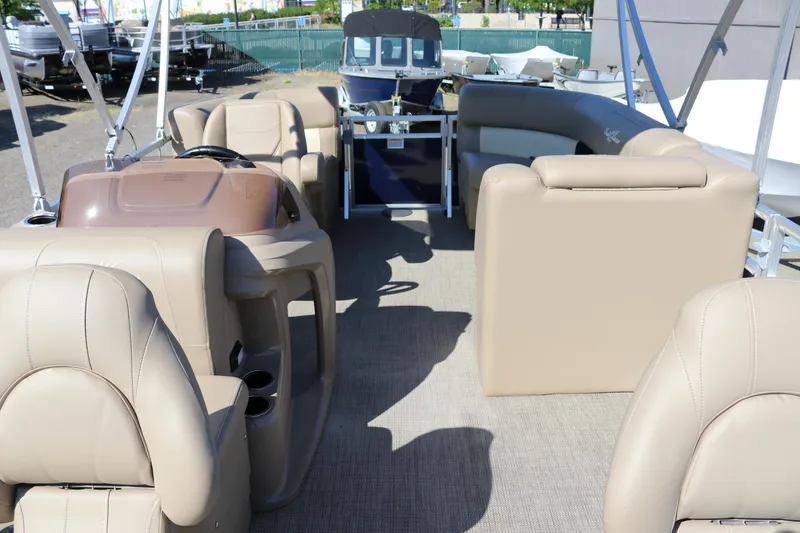 Slide: The Image of Interior of 2025 Sun Chaser Vista Fish 18 pontoon boat with beige seating. - 26