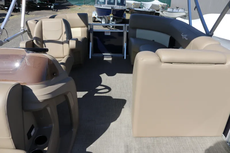 Slide: The Image of Interior of 2025 Sun Chaser Vista Fish 18 pontoon boat with beige seating. - 9