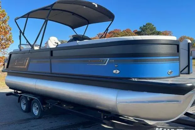 The Image of 2023 Viaggio Diamante 23B pontoon boat on trailer, blue and black design. - 0