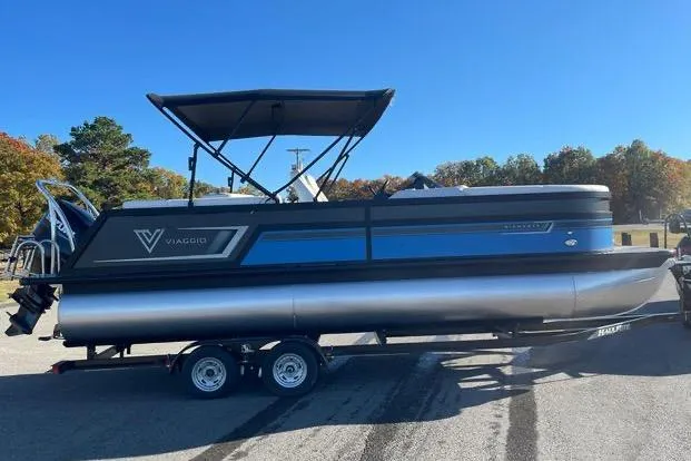 Slide: The Image of 2023 Viaggio Diamante 23B pontoon boat on trailer, featuring sleek design and canopy. - 11
