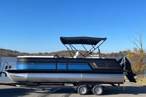 Slide: The Image of 2023 Viaggio Diamante 23B pontoon boat on trailer by a lake. - 15