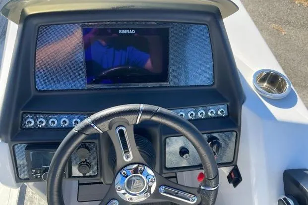 Slide: The Image of Steering console of 2023 Viaggio Diamante 23B boat with Simrad display. - 2