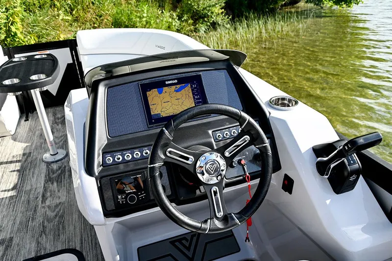 Slide: The Image of Manufacturer Provided Image: 2023 Viaggio Diamante B boat dashboard with steering wheel and navigation screen. - 22