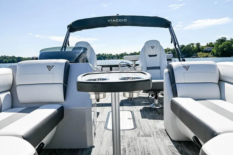 Slide: The Image of Manufacturer Provided Image: 2023 Viaggio Diamante B boat interior with luxurious seating and cup holders on a sunny day. - 23