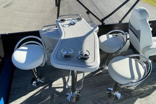 Slide: The Image of Luxurious seating area on 2023 Viaggio Diamante 23B boat with modern bar stools and table. - 5