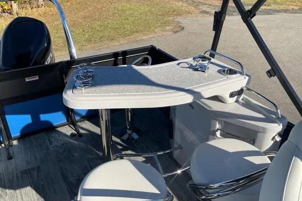 Slide: The Image of 2023 Viaggio Diamante 23B boat interior with seating and table setup. - 6