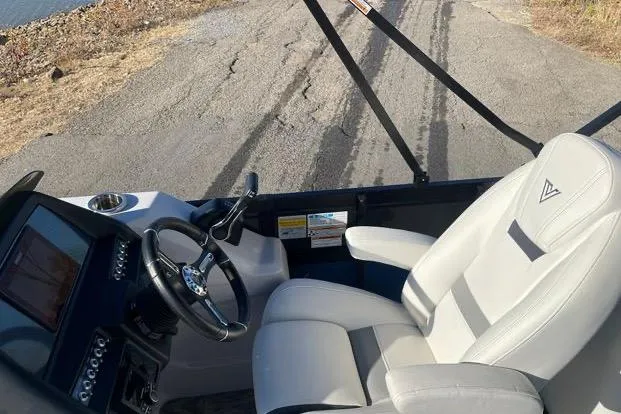 Slide: The Image of 2023 Viaggio Diamante 23B boat interior with steering wheel and comfortable seating. - 7