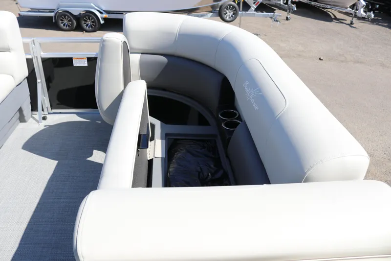 Slide: The Image of 2025 SunChaser Vista 20 Fish boat interior with cushioned seating and cup holders. - 18