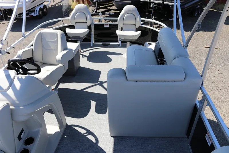 Slide: The Image of 2025 SunChaser Vista 20 Fish pontoon boat interior with seating and steering console. - 27