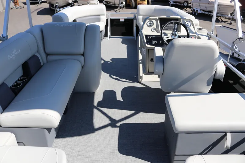 Slide: The Image of 2025 SunChaser Vista 20 Fish pontoon boat interior with plush seating and modern helm. - 31