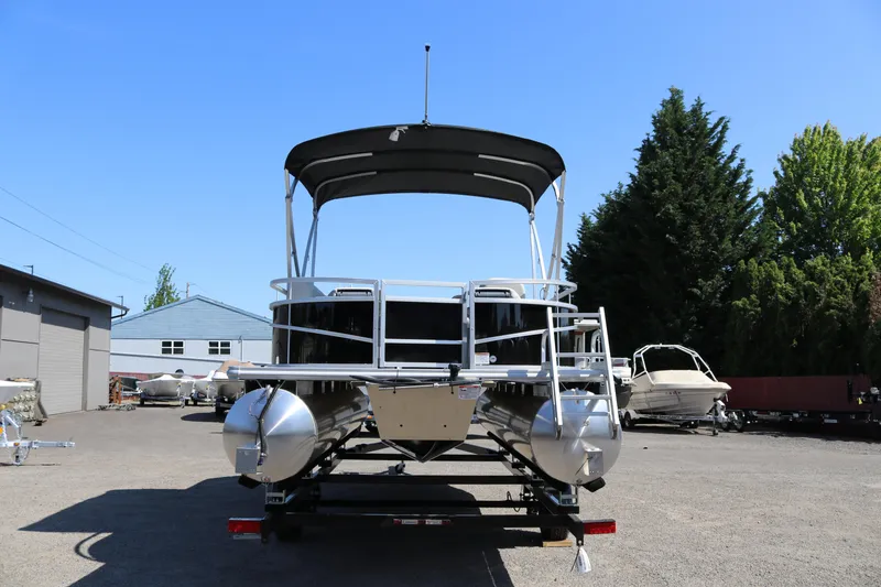 Slide: The Image of 2025 SunChaser Vista 20 Fish pontoon boat parked outdoors on a sunny day. - 4