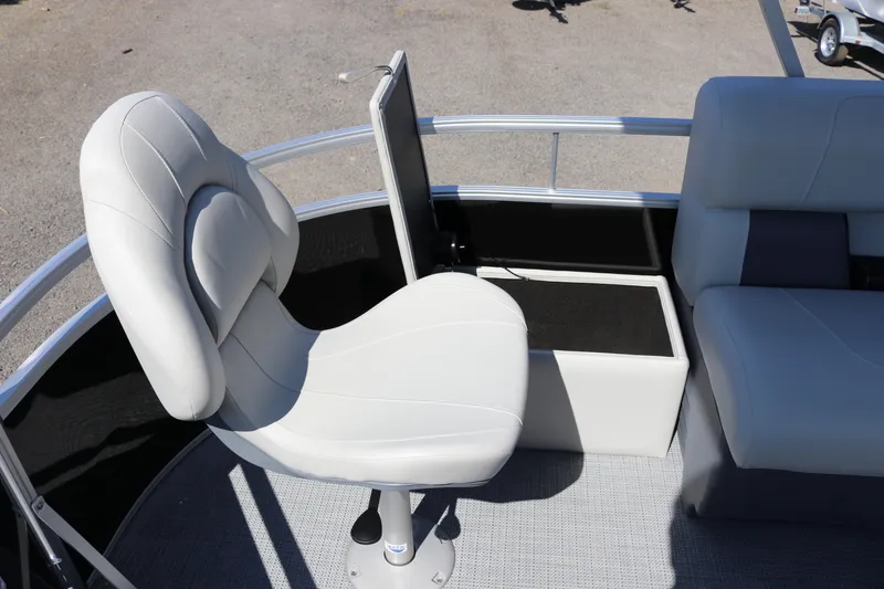 Slide: The Image of SunChaser Vista 20 Fish 2025 boat interior with white swivel seat and cushioned bench. - 9