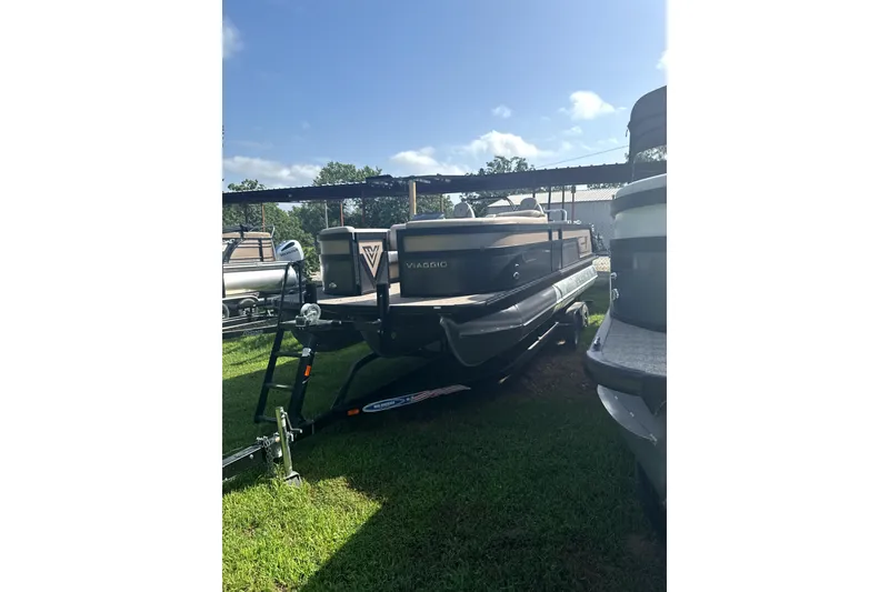 The Image of 2023 Viaggio Diamante S pontoon boat on trailer, parked on grass. - 0