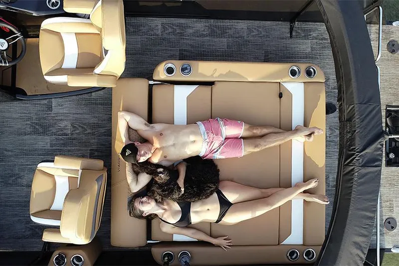Slide: The Image of Manufacturer Provided Image: Couple relaxing on Viaggio Diamante S 2023 boat, enjoying sunbathing on deck. - 12
