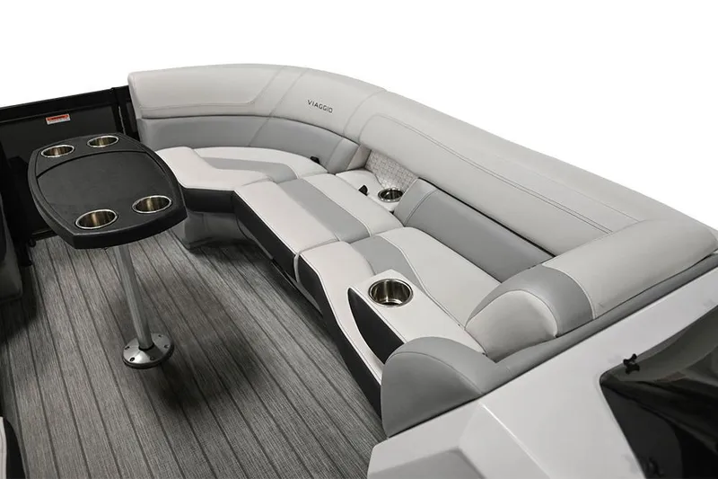Slide: The Image of Manufacturer Provided Image: 2023 Viaggio Diamante S boat interior with gray seating and table with cup holders. - 13