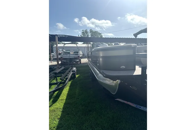 Slide: The Image of 2023 Viaggio Diamante S boat parked on grass under a sunny sky. - 2