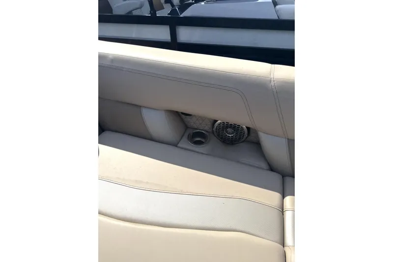 Slide: The Image of 2023 Viaggio Diamante S boat interior with beige seating and built-in speaker. - 4