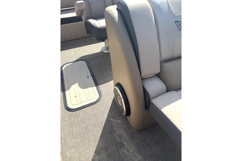 Slide: The Image of Interior of 2023 Viaggio Diamante S boat with beige seating and carpeted floor. - 5