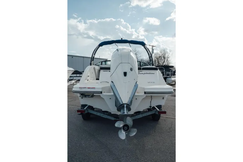 Slide: The Image of 2023 Sea Ray SPX 230 Outboard boat, rear view with outboard motor, parked outdoors. - 3