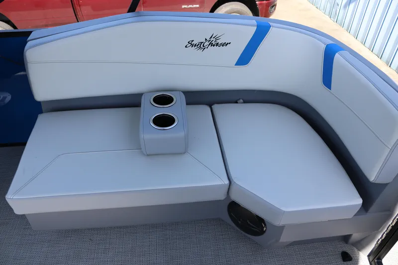 Slide: The Image of 2025 SunChaser Lucerne 20 LR DH boat seating with cup holders, featuring blue accents. - 11