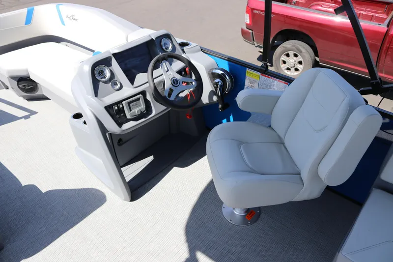 Slide: The Image of 2025 SunChaser Lucerne 20 LR DH boat interior with steering console and captain's chair. - 15