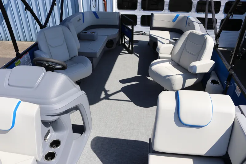Slide: The Image of 2025 SunChaser Lucerne 20 LR DH pontoon boat interior with plush seating and helm. - 18
