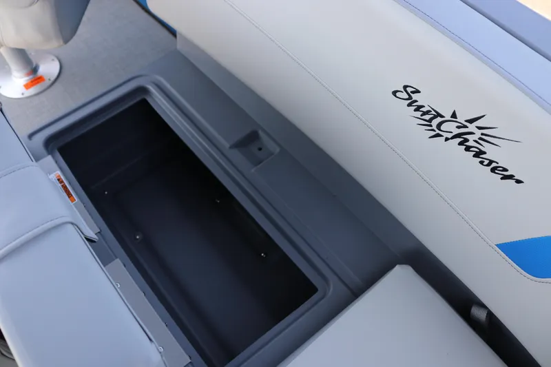 Slide: The Image of SunChaser Lucerne 20 LR DH 2025 boat seat with storage compartment open. - 19