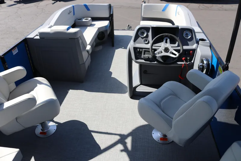 Slide: The Image of 2025 SunChaser Lucerne 20 LR DH pontoon boat interior with modern seating and steering console. - 27
