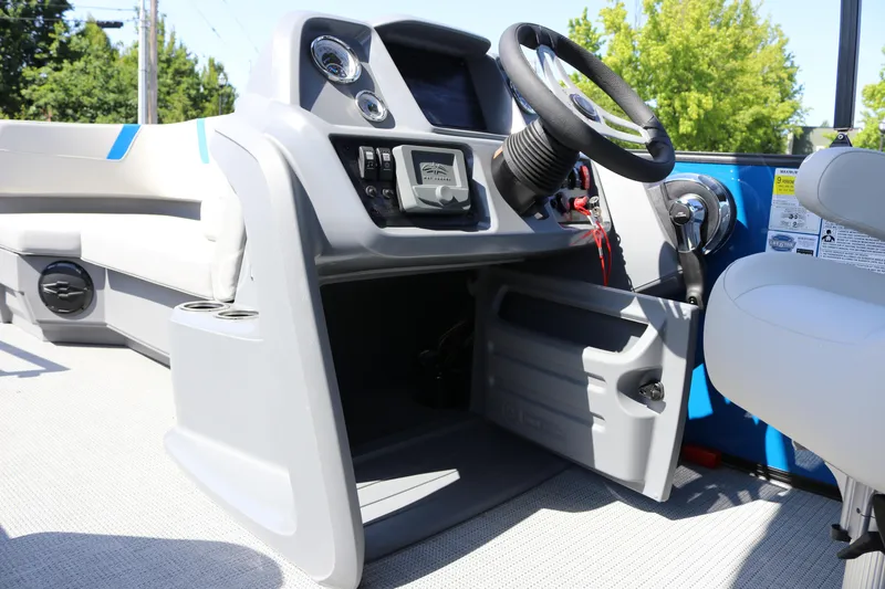 Slide: The Image of 2025 SunChaser Lucerne 20 LR DH boat interior with steering wheel and control panel. - 28