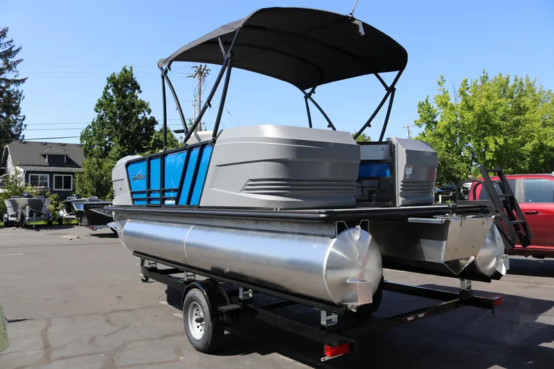 Slide: The Image of 2025 SunChaser Lucerne 20 LR DH pontoon boat on trailer, parked outdoors. - 3