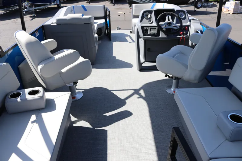 Slide: The Image of 2025 SunChaser Lucerne 20 LR DH pontoon boat interior with plush seating and modern helm. - 8