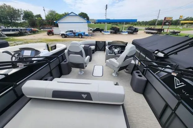 Slide: The Image of 2024 Viaggio Lago X22S pontoon boat interior with seating and steering wheel. - 4