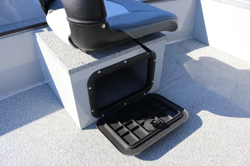 Slide: The Image of 2025 Smoker Craft Pro Lodge 160 boat seat with open storage compartment. - 14
