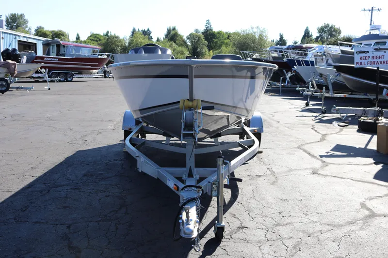 Slide: The Image of 2025 Smoker Craft Pro Lodge 160 boat on trailer in outdoor lot. - 5