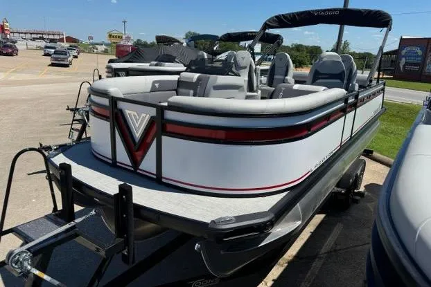 Slide: The Image of 2024 Viaggio Lago X22Q pontoon boat with sleek design in a parking lot. - 3