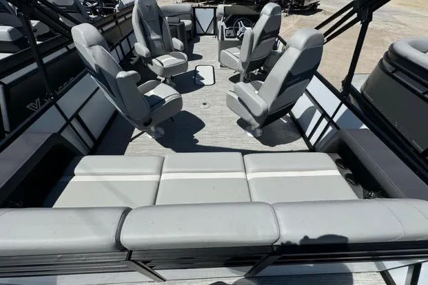 Slide: The Image of 2024 Viaggio Lago X22Q pontoon boat interior with gray seating and spacious layout. - 4