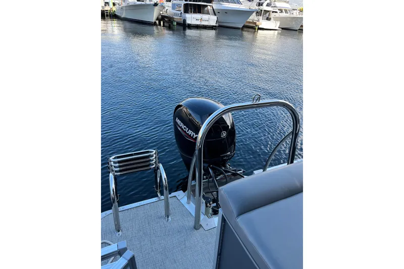Slide: The Image of 2023 Tahoe Pontoon LTZ Cruise with Mercury outboard motor at marina. - 10