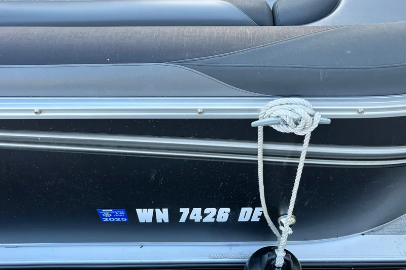 Slide: The Image of 2023 Tahoe Pontoon LTZ Cruise with registration number WN 7426 DE, docked with rope. - 6