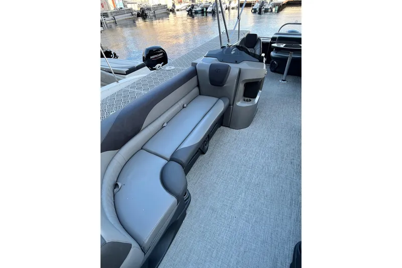 Slide: The Image of 2023 Tahoe Pontoon LTZ Cruise interior with gray seating and water view. - 8