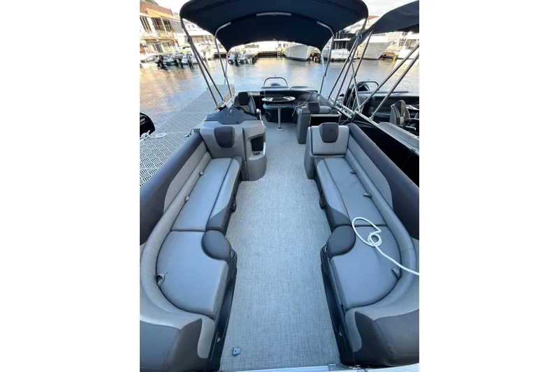 Slide: The Image of 2023 Tahoe Pontoon LTZ Cruise interior with spacious seating and modern design. - 9