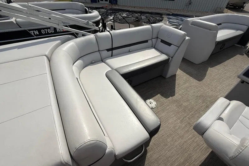 Slide: The Image of 2023 Godfrey Sweetwater 2286 C pontoon boat interior with plush seating and modern design. - 5