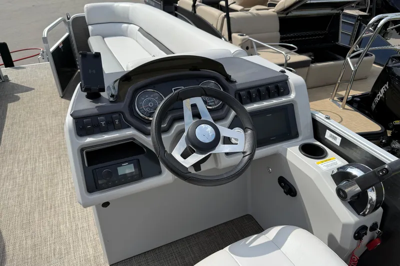 Slide: The Image of 2023 Godfrey Sweetwater 2286 C boat dashboard with steering wheel and controls. - 8