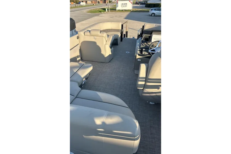 Slide: The Image of 2024 Silver Wave 2410 SW3 RLP boat interior with plush seating and modern dashboard. - 2