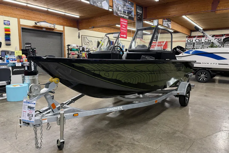 Slide: The Image of 2025 Smoker Craft Excursion 166 SC Pro boat displayed in showroom on trailer. - 3