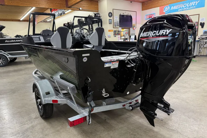 Slide: The Image of 2025 Smoker Craft Excursion 166 SC Pro boat with Mercury outboard motor in showroom. - 4