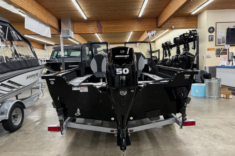 Slide: The Image of 2025 Smoker Craft Excursion 166 SC Pro boat with Mercury 50 engine in showroom. - 6