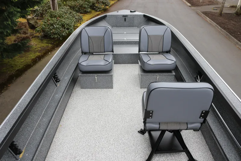 Slide: The Image of 2024 Alumaweld Free Drifter 20 boat interior with three gray seats. - 3