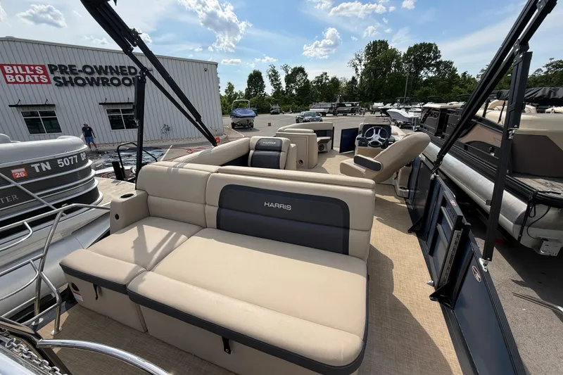 Slide: The Image of 2024 Harris Cruiser 230 pontoon boat at Bill's Boats pre-owned showroom. - 6